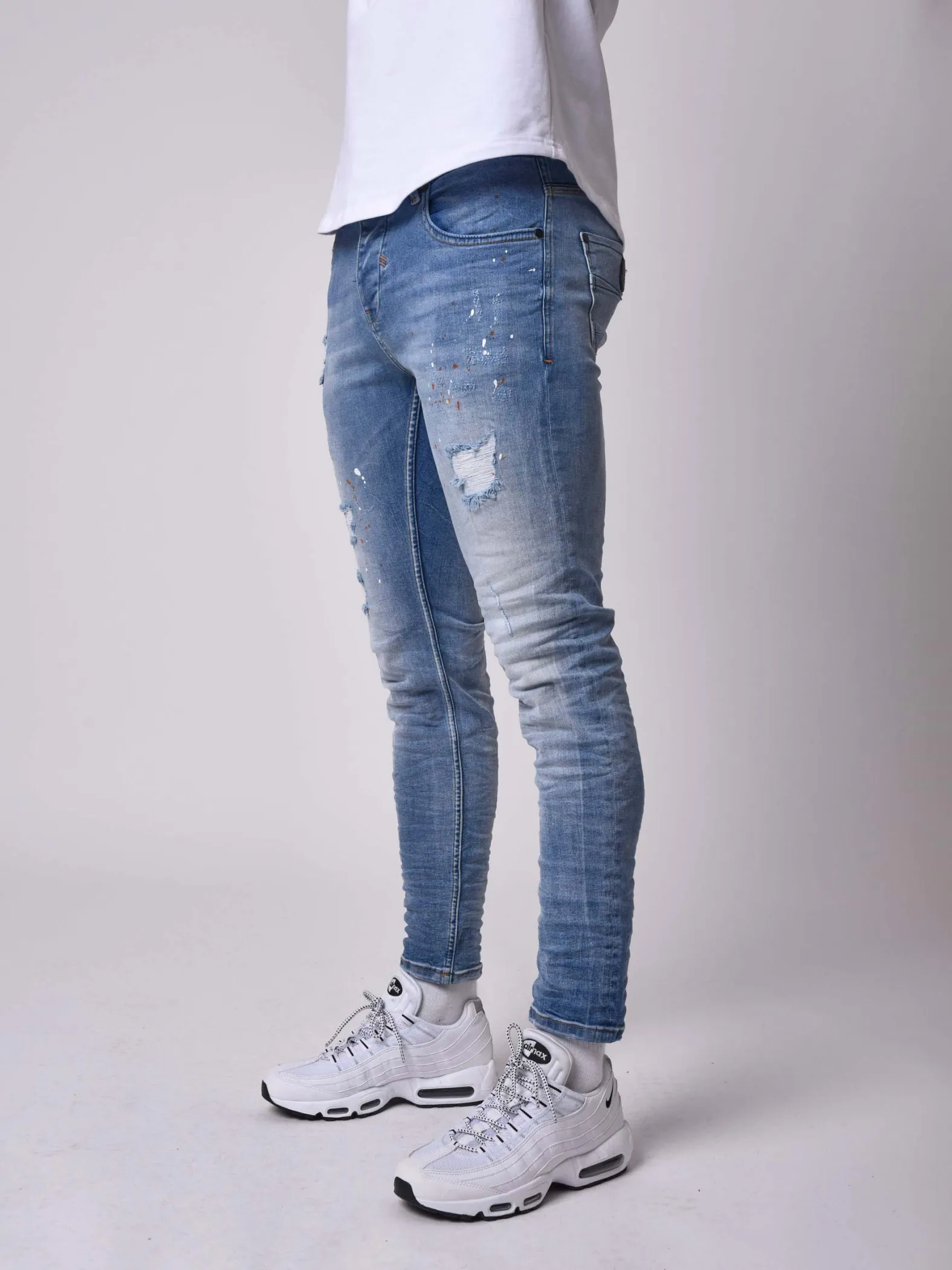 Jeans pitillo efecto desgastado azul claro jaspeado