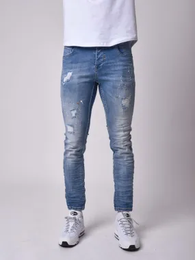 Jeans pitillo efecto desgastado azul claro jaspeado