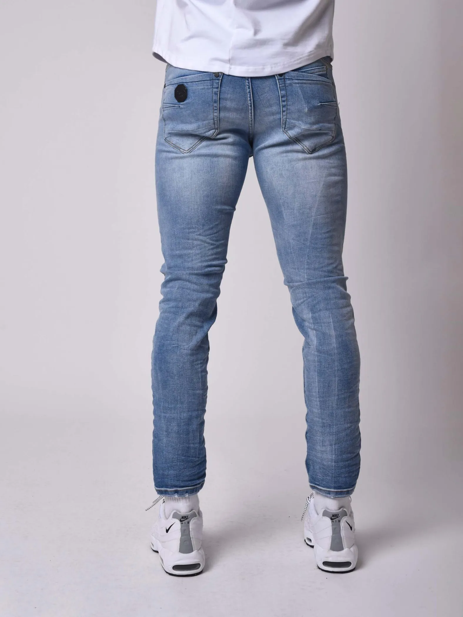 Jeans pitillo efecto desgastado azul claro jaspeado